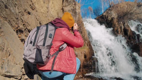 Woman Tourist Shoots Waterfall