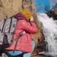 Woman Tourist Shoots Waterfall - VideoHive Item for Sale