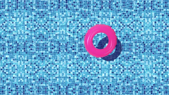 Pink inflatable toy buoy in swimming pool