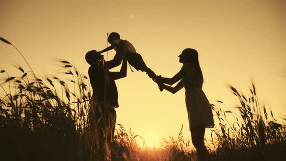 Silhouette Happy Family Walking Outdoors