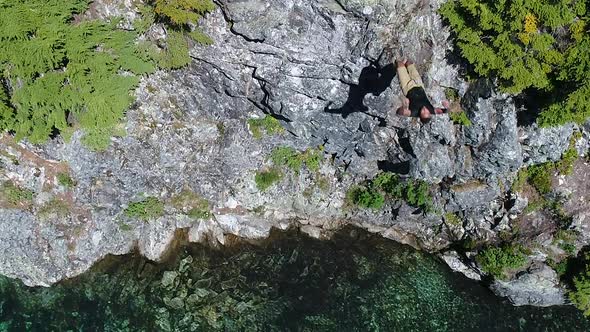 Cliff Diving Sport Man Backflip Backwards Into Clear Turquoise Lake Water