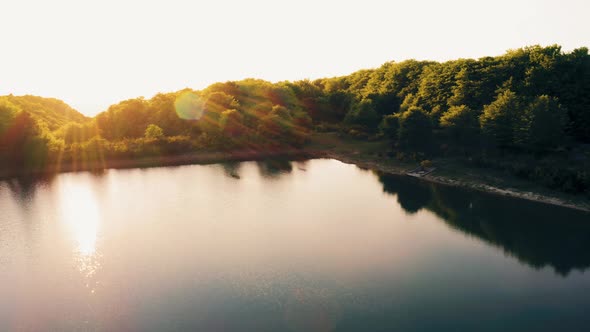 Aerial view of mountain lake at sunset