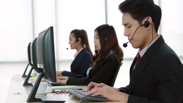 Business People Wearing Headset Working in Office