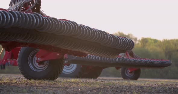 Footage of the Racks with Blades of a Modern Tilling Machine for Plowing