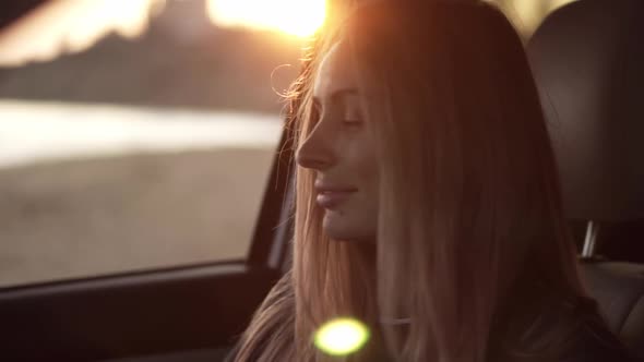 Beautiful Woman Lookingto the Camera From the Car Then Go Out From the Car Seat to the Seashore