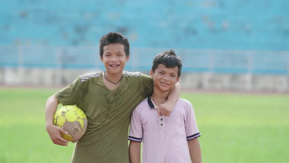 Asian Kids Smile With A Soccer Ball