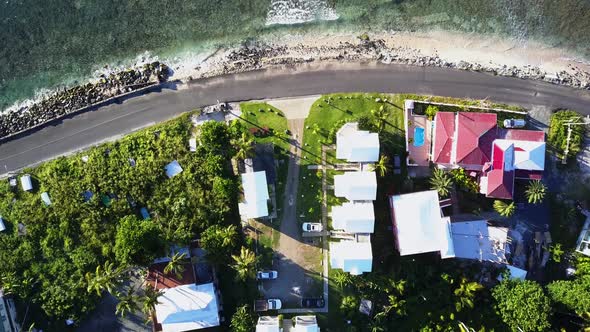 Aerial British Virgin Island Tortola overhead shot of local homes as a car pull in the driveway