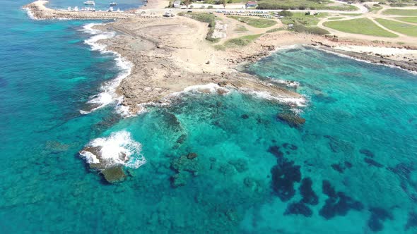 Top View of Deserted Sea Spit with Transparent Ocean Waters Around. Aerial View of Blue Clear