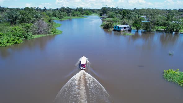 Boat sailing at Amazon River at Amazon Rainforest. Manaus Brazil.