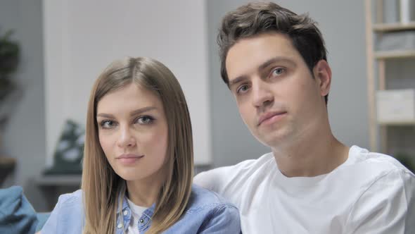 Close Up of Young Couple Looking at Camera