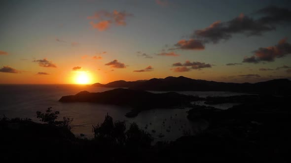 Time Lapse of Sunset Sun Going Down After Mountain Clouds Pass By Dark Sky