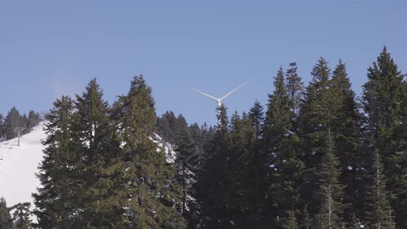 Wind Turbine on Top of Grouse Mountain During Sunny Winter Season