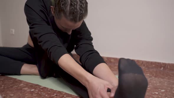 Woman's leg on the floor of the dining room at home and during online class