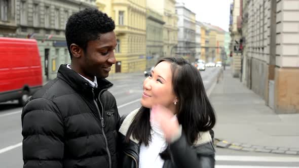 Happy Couple Smile To Camera - Black Man and Asian Woman - Urban Street with Car