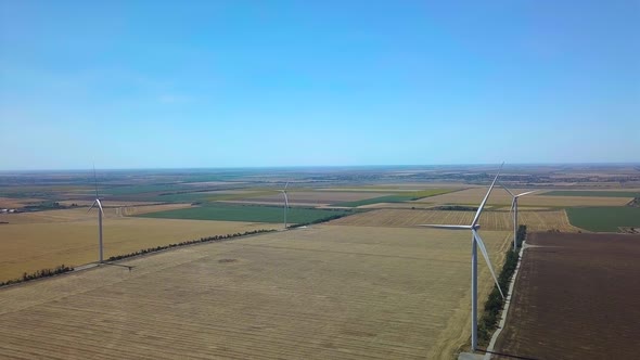 Aerial View of Windmills Rotating By the Force of the Wind and Generating Renewable Energy. 