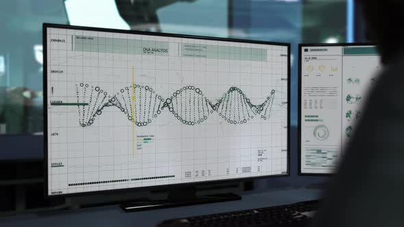 Scientist works on computer. DNA sequence analysis with the help of a software. alt