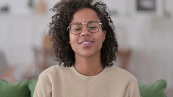 Portrait of African Woman Shaking Head in Approval