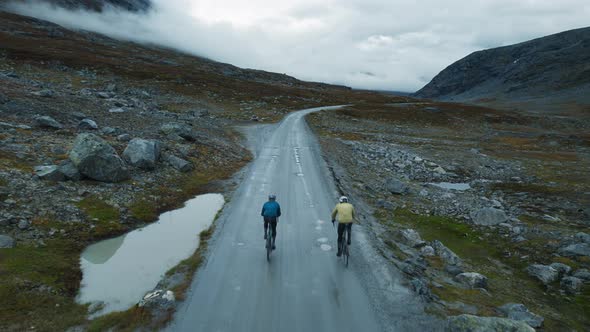 Epic Drone View of Two Cyclist Training on Road