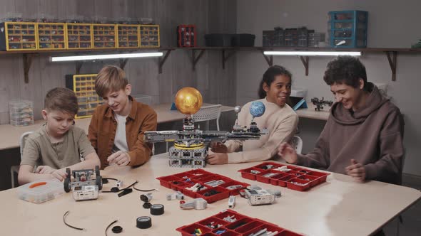 Group Of Kids Having Model Construction Class