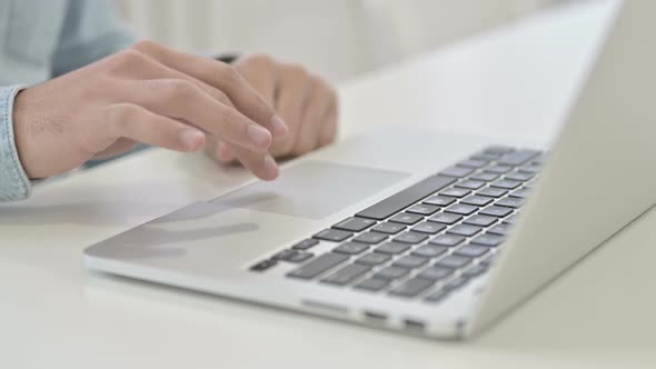 Close Up of Hands Working on Laptop