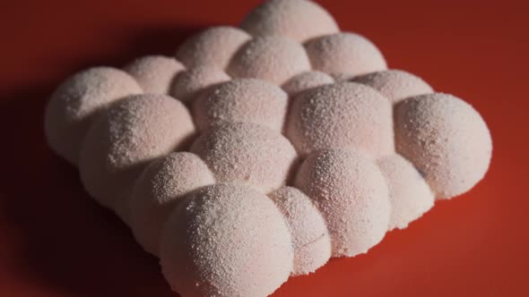 Tasty Cake Pops of White Balls on the Black Table