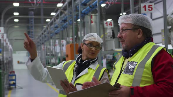 Warehouse workers discussing together