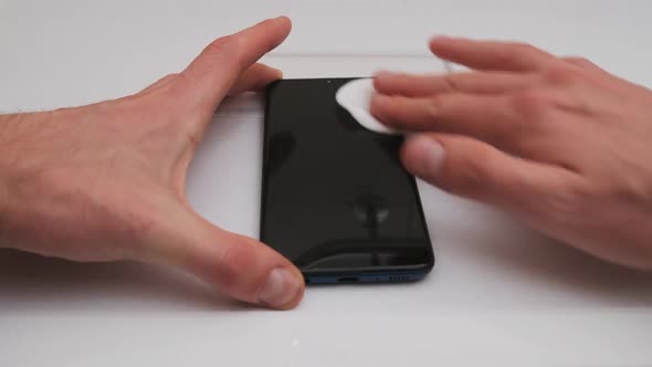 Preparing to Replace the Protective Glass on a Smartphone Degreasing Screen