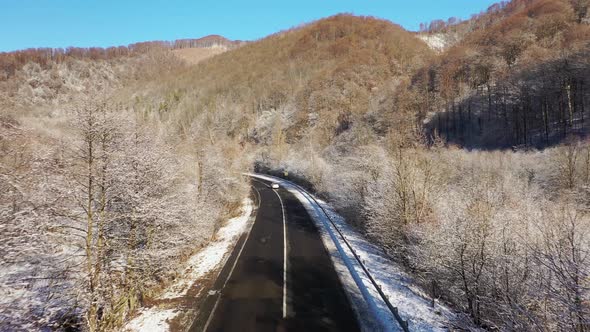 The Car in Winter on Way Aerial View