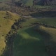 Green meadow hiils and forest. Aerial nature shot. - VideoHive Item for Sale