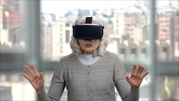 Amazed Senior Woman with Virtual Reality Headset
