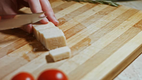 Gnocci with Tomato Sauce Being Sprinkled with Parmesan