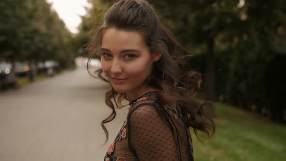 Fashion Walking Woman Portrait in Black Dress