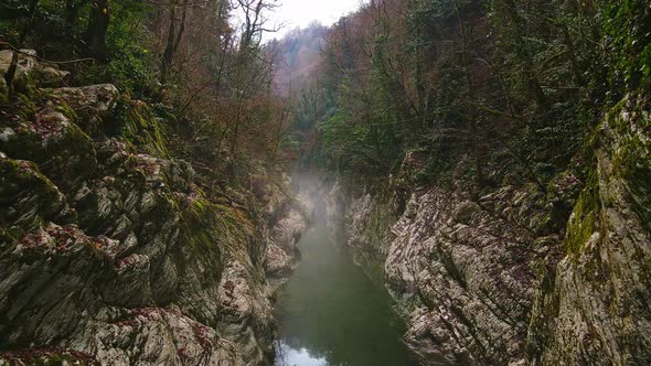 River in a Narrow Canyon with White Rocks