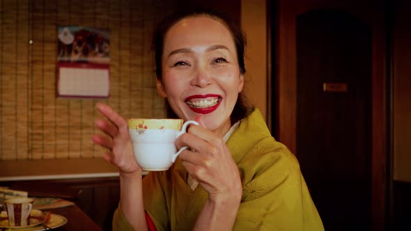 Elegant Japanese woman enjoying a coffee