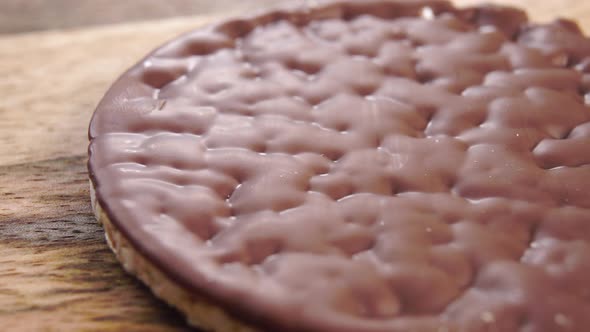 Texture of chocolate rice cake on a textured board. Macro