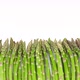 Green asparagus on white background, sliding shot - VideoHive Item for Sale