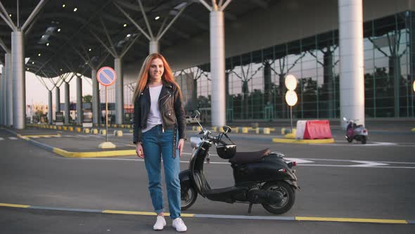 Young Stylish Woman Wearing Leather Jacket Woman Near Vintage Scooter on Urban Background