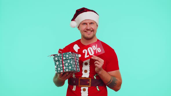 Man in Red Christmas Tshirt Showing Gift Box and 20 Percent Discount Inscriptions Banner Text Note