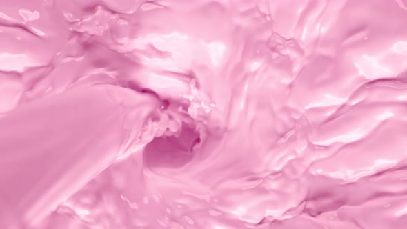 Super Slow Motion Shot of Pouring Pink Milk Into Wortex at 1000Fps.