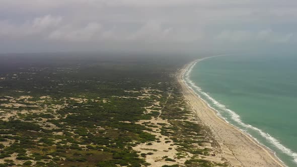 Sandy Beach and Ocean Surf with Waves