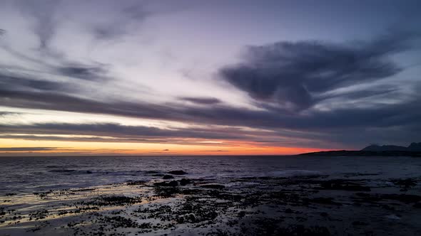 Unique cloud patterns during blue hour and golden horizon, drone flight