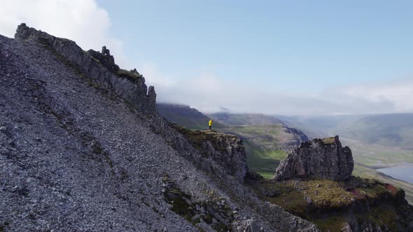 Drone Flight To Man Standing On Mountain Peak