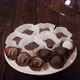 Closeup of a Tray of Sugarfree Chocolates on a Wooden Background - VideoHive Item for Sale