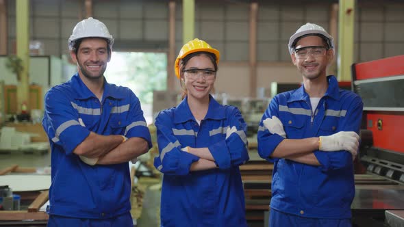 Portrait Group of male and female industrial worker working in factory.