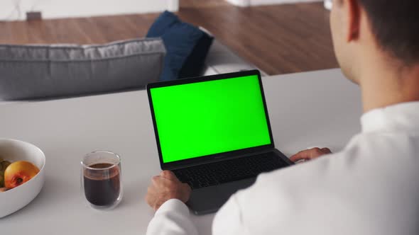 Person Using Video Conferencing Technology From Home for Video Call Green Screen