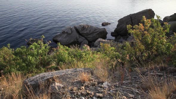 Sea Surf. Calm Waves Run Over the Rocky Shore Near the Golitsyn Trail in the Village of Novy Svet