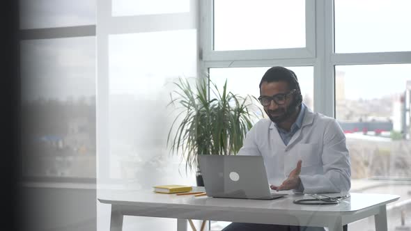 Male MD Communicating with a Patient Via Video Calling