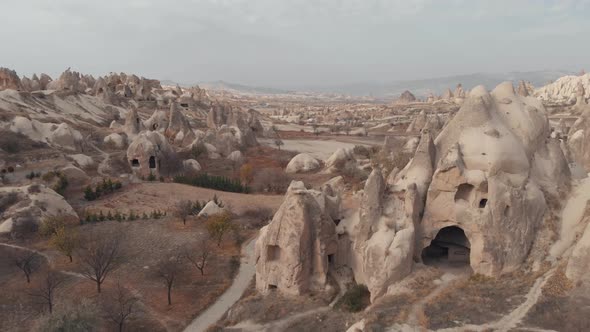 Cappadocia landscape with fairy chimney rock formations. Aerial forward