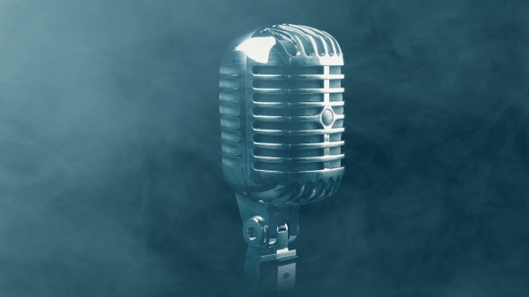 Vintage Microphone Rotating In Smoky Atmosphere