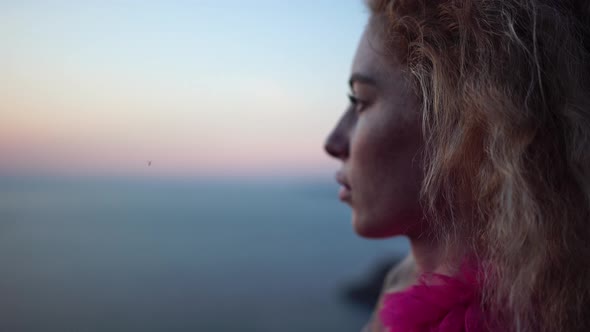 Abstract Defocused Shot of Beautiful Young Caucasian Woman with Curly Blond Hair and Freckles